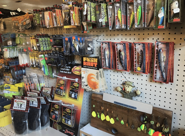 assortment of fishing gear on a wall