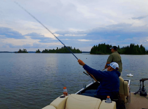 men fishing in a boat