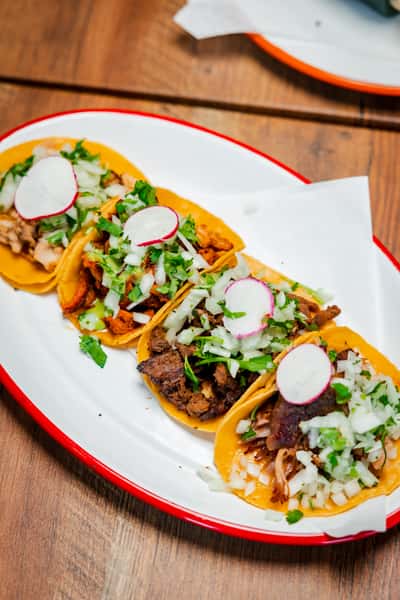 Four tacos with meat