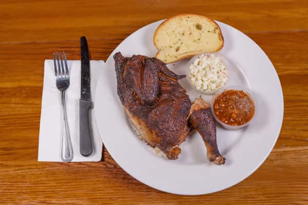 Half smoked chicken plate with toast and sides at Jake & Rip's in Grenada, Mississippi.