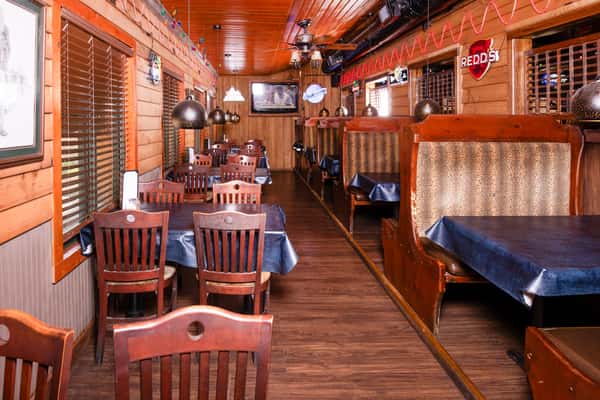 Front dining area with booths and tables inside Jake & Rip's in Grenada, Mississippi.