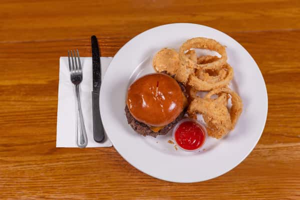 Cheeseburger with onion rings and dipping sauce at Jake & Rip's in Grenada, Mississippi.