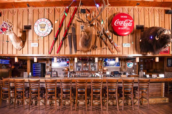 Rustic bar area inside Jake & Rip's, a cozy barbecue and seafood restaurant in Grenada, MS.