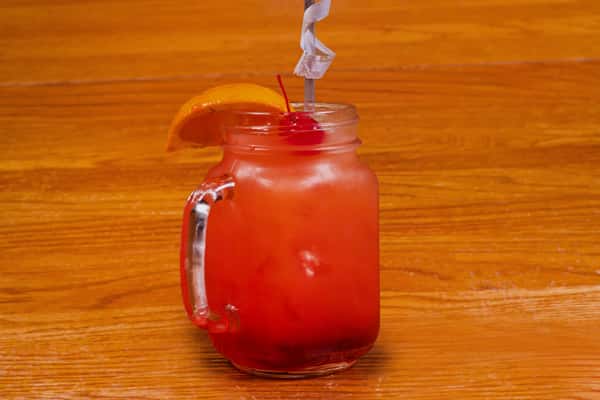 Delta Sunrise drink in mason jar with citrus garnish at Jake & Rip's in Grenada, Mississippi.