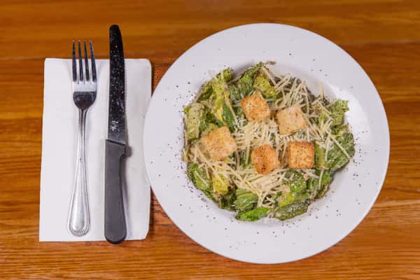 Classic Caesar salad with croutons and parmesan cheese at Jake & Rip's in Grenada, MS.
