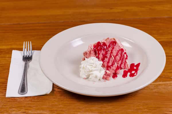 Strawberry cake dessert topped with whipped cream at Jake & Rip's in Grenada, MS.