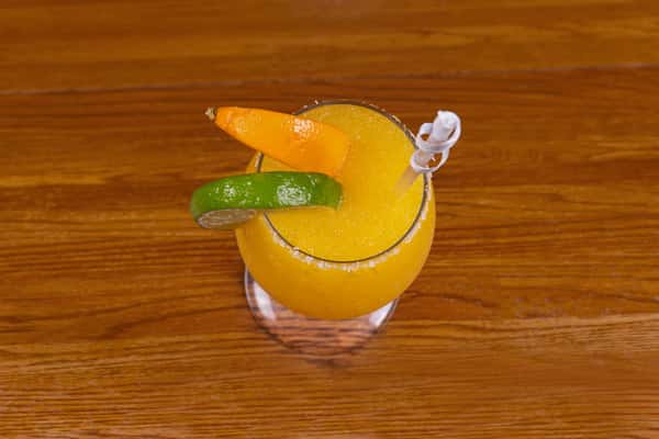 Frozen mango margarita with lime garnish at Jake & Rip's bar in Grenada, Mississippi.