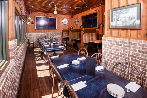 Cozy dining room seating inside Jake & Rip's barbecue restaurant in Grenada, Mississippi.