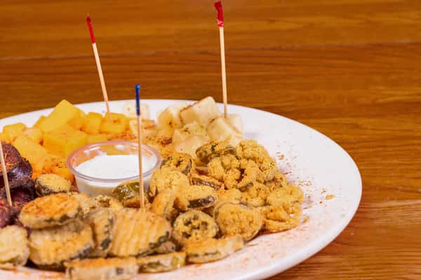 Appetizer cheese plate with sausage, crackers, and fried bites at Jake & Rip's in Grenada, Mississippi.