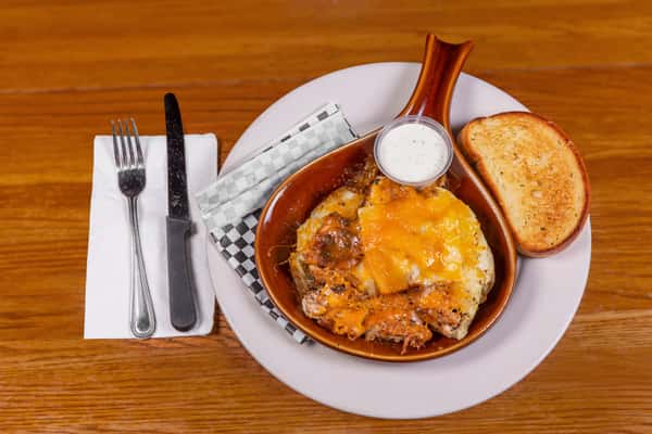 Loaded chicken tater topped with melted cheese and bacon at Jake & Rip's in Grenada, Mississippi.