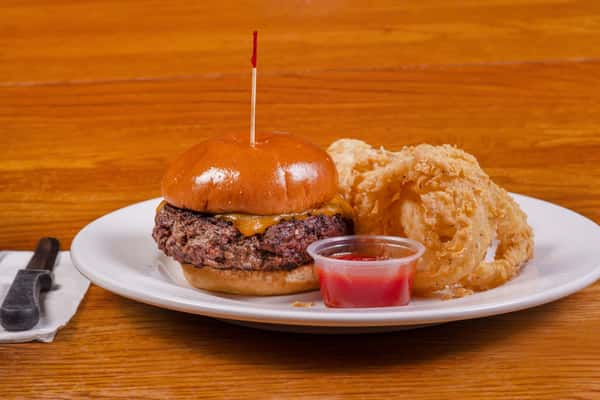 Cheeseburger with onion rings and dipping sauce at Jake & Rip's in Grenada, Mississippi.