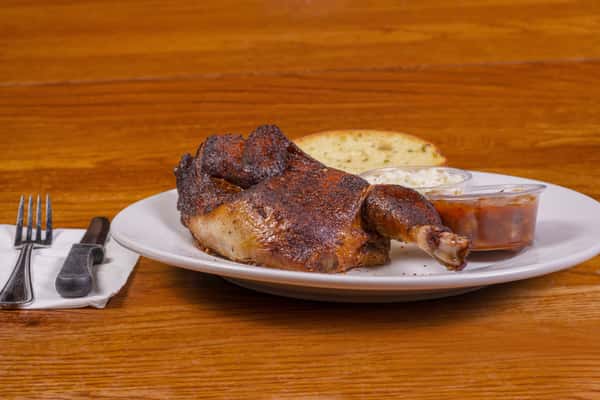 Half smoked chicken plate with sides at Jake & Rip's barbecue restaurant in Grenada, MS.