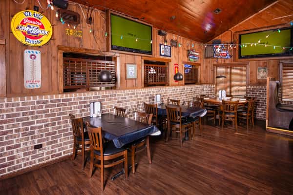 Casual bar seating and dining area inside Jake & Rip's restaurant in Grenada, Mississippi.