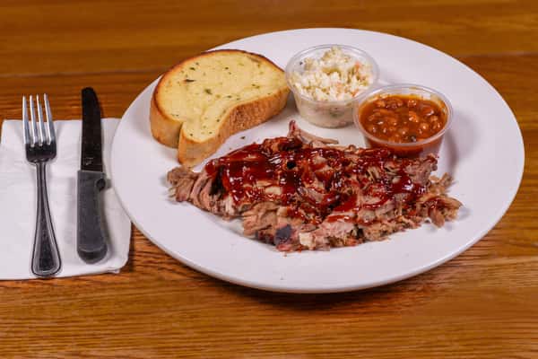 Pulled pork barbecue plate with baked beans, coleslaw, and toast at Jake & Rip's in Grenada, MS.