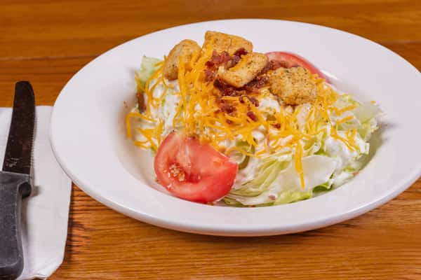 Fresh wedge salad with tomatoes and cheese at Jake & Rip's in Grenada, MS.