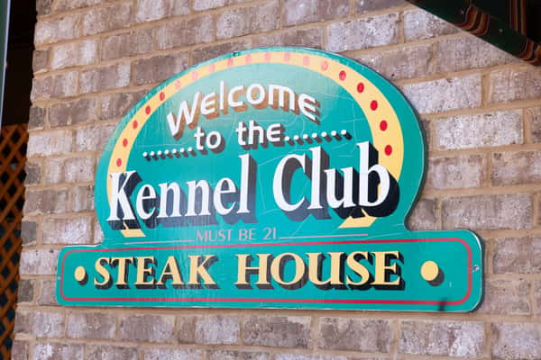 Kennel Club Steak House exterior sign in Grenada, Mississippi near Jake & Rip's.