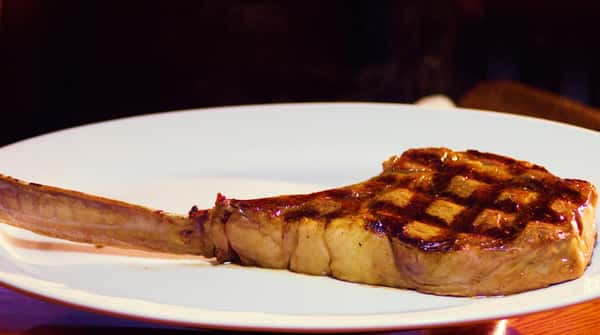 Cooked Tomahawk steak on a plate