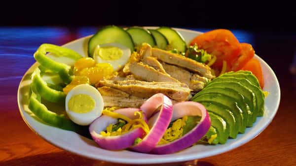 chicken salad with onions, avocado, tomoatoes, and chicken