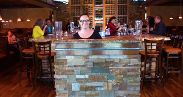 hostess greeting guests at the counter