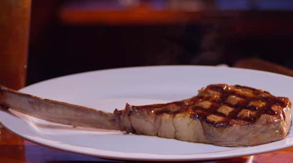 Cooked Tomahawk steak on a plate