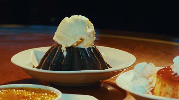 chocolate cake with vanilla ice cream on top