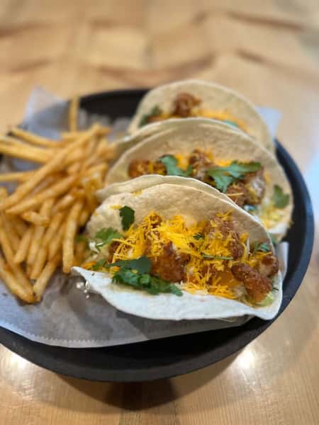 Three tacos and fries