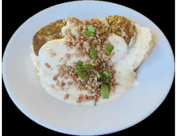 Biscuit and Gravy Bowl with 2 sausage patties, Sausage, Bacon Crumbles and Scallions.