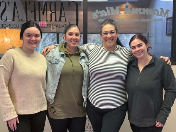 Management team from Mamma Mia's Pinehillsstanding together at the corporate Manager Appreciation Breakfast, recognized for their leadership and contributions."