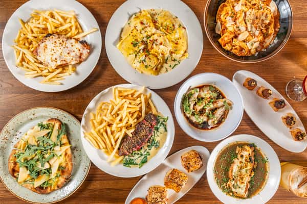 spread of dishes including fries, meat and more