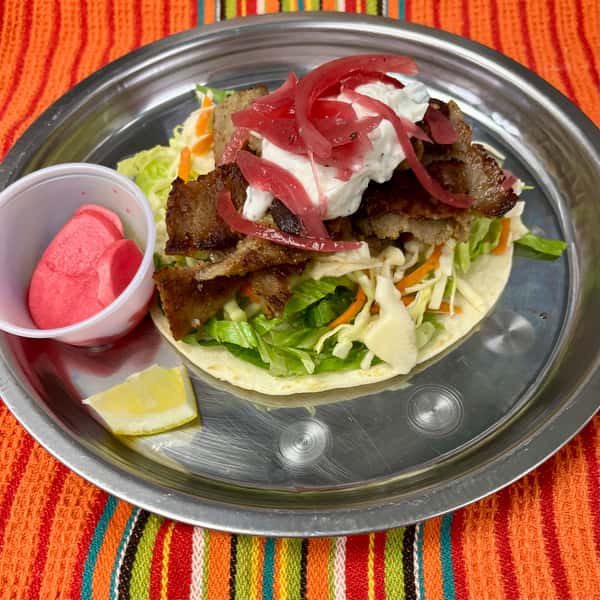 $7 . Lamb Gyro . Spit-Roasted Lamb . Lettuce . Pepper Vinegar Slaw . Tzatziki Sauce . Pickled Red Onion . Flour Tortilla .