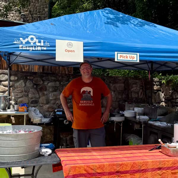 Chef Brian standing in his outdoor kitchen 