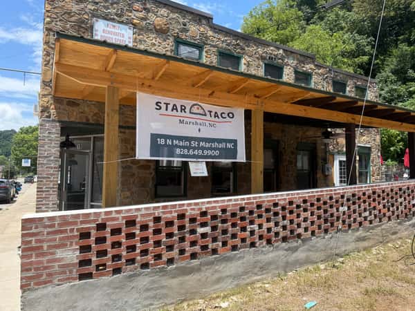 Star Taco's sign hanging in the from of the covered patio