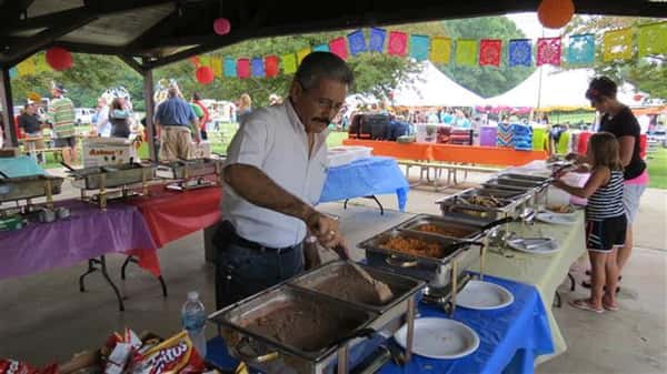 A man serving himself food.