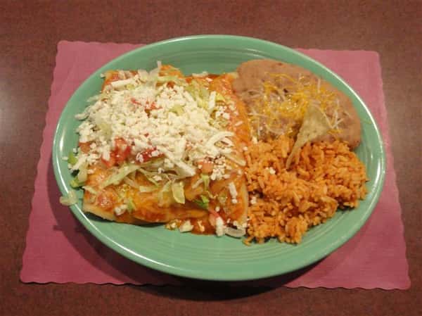 Rice and beans with a side of lettuce tomatoes and cheese