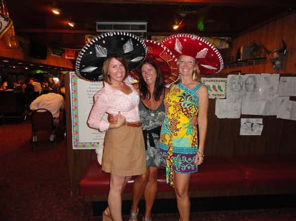 People wearing hats taking a photo
