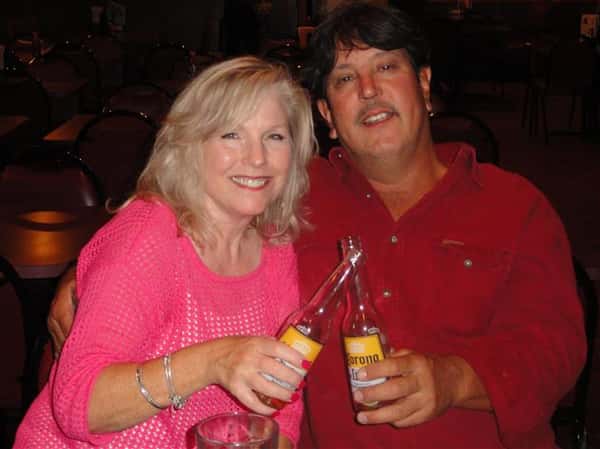 2 People cheering while taking a photo