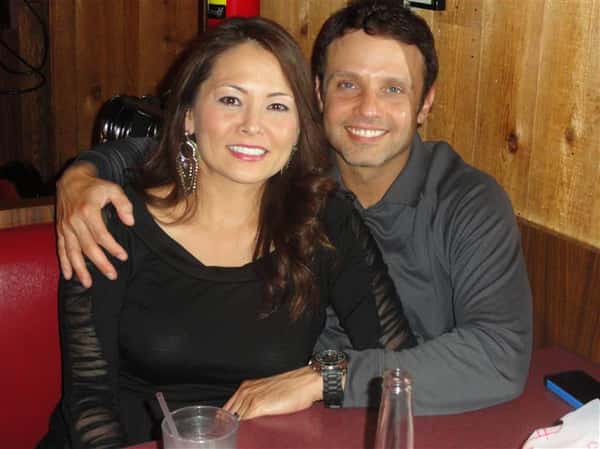 Couple taking a photo at dining table