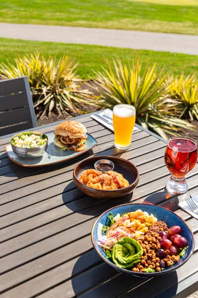 Cajun burger and tempura prawns on the patio overlooking the golf course
