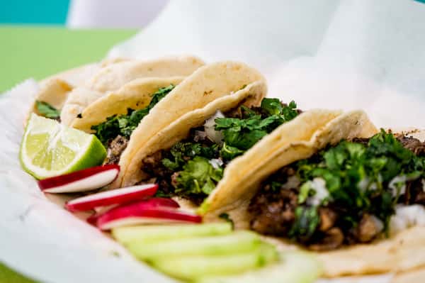 tacos with veggies on the side