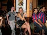 four customers sitting around the bar area