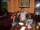 a couple posing together at a booth