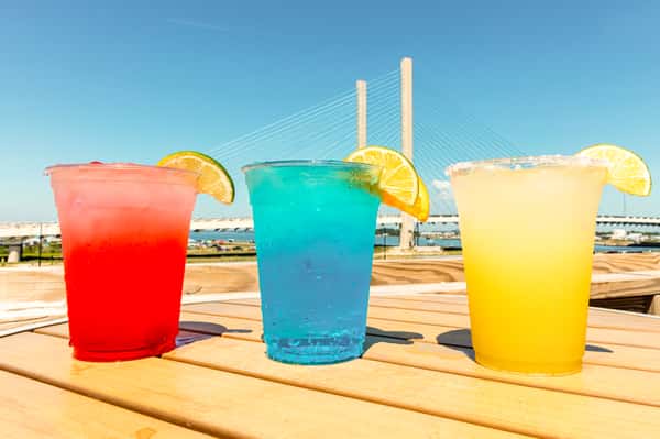 three colorful beverages