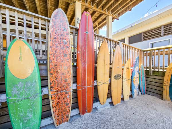 row of colorful surfboards