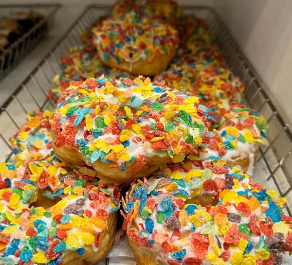 Donuts with fruity pebbles on them