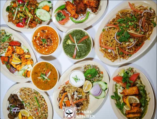 Hero shot of multiple dishes on a white table