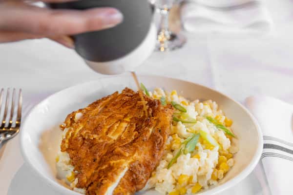 crispy fried chicken served with mashed potatoes and macaroni and cheese on a comfort food plate