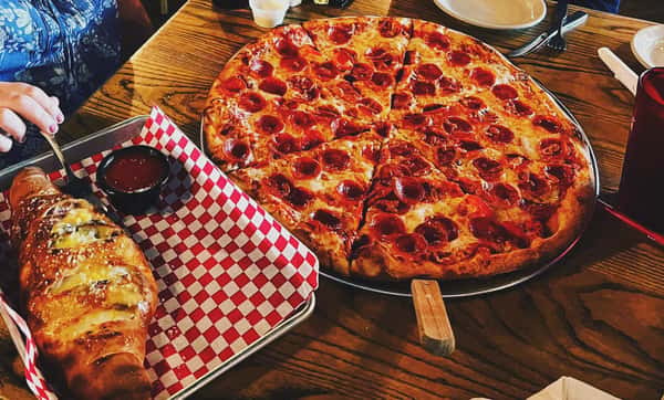 Stromboli on the left and XL peperoni pizza on the right.