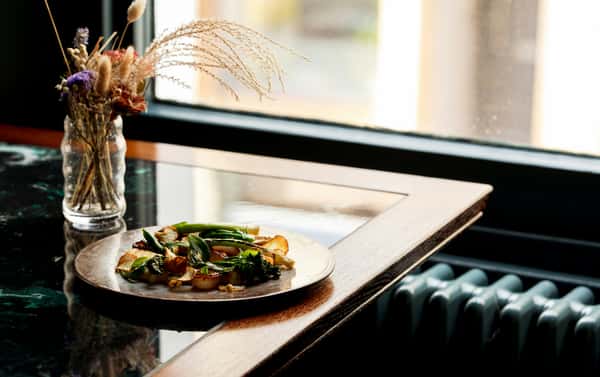 Shot of a plate of food on a well lit nice table