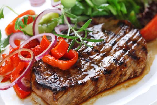 Grilled steak with peppers and greens