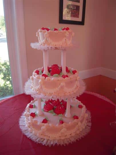 three layer cake with fake edible roses